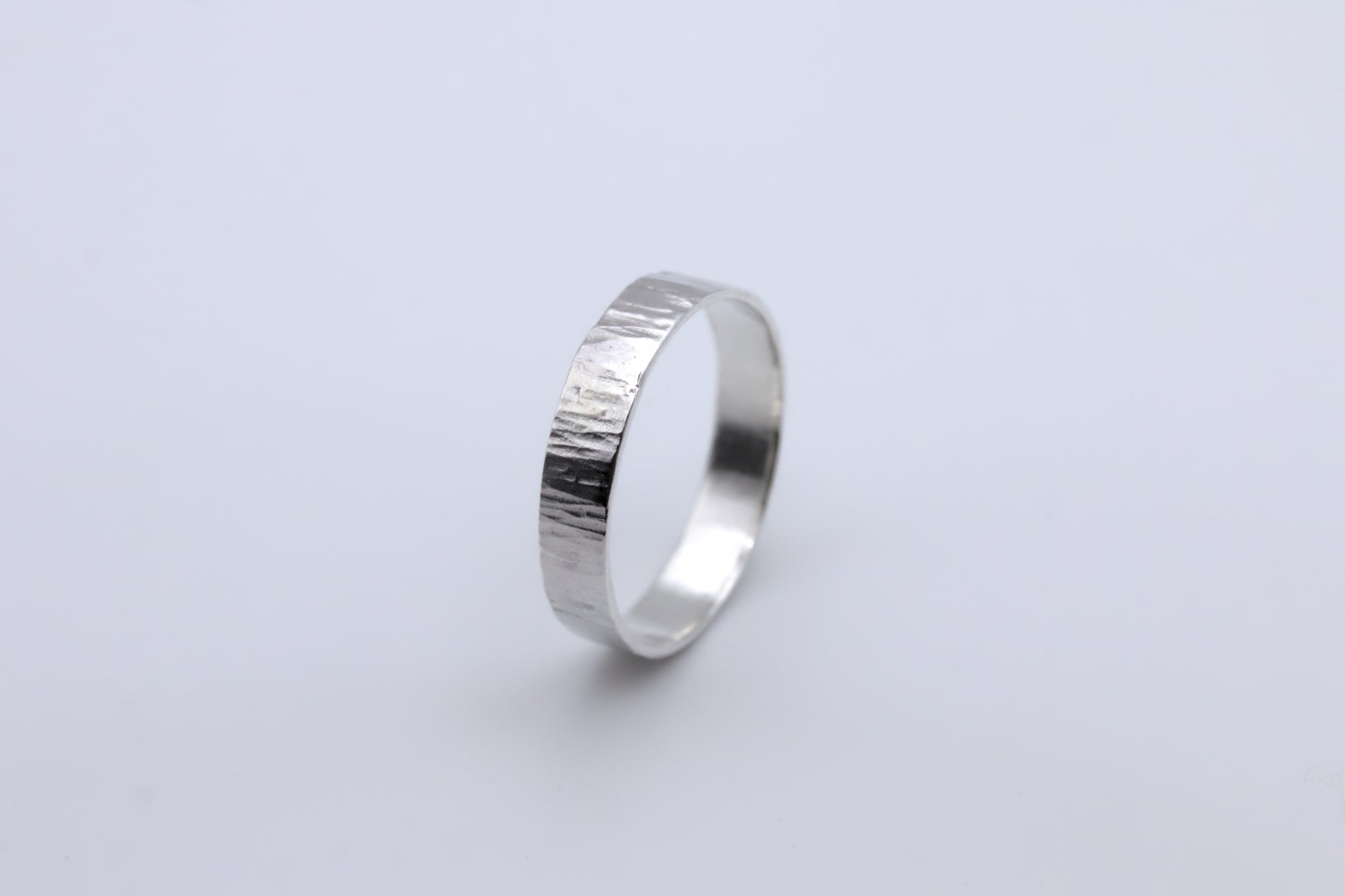 A hammered bark texture silver ring