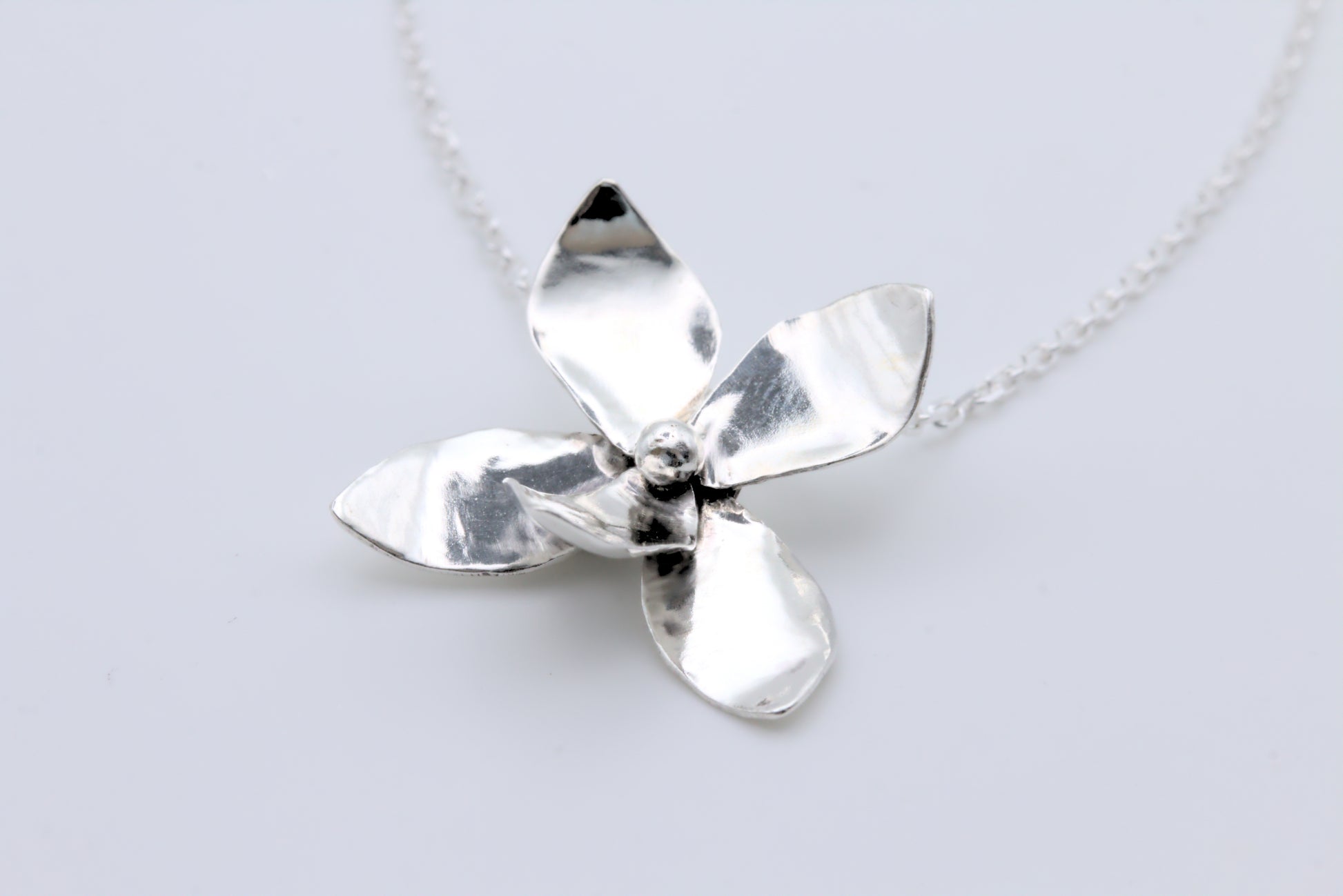 a sweet violet flower pendant in silver